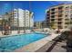 Resort-style pool area with ample seating for lounging at 7960 E Camelback Rd # 209, Scottsdale, AZ 85251
