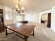 Classic dining room with vintage chandelier with potential for gathering and entertaining at 8217 E Medina Ave, Mesa, AZ 85209