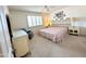 Main bedroom with comfortable carpet, shuttered window, and decorative furniture at 8217 E Medina Ave, Mesa, AZ 85209