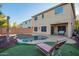 Beautiful backyard oasis with a freeform pool, lounge chair, and covered patio at 9009 S 57Th Dr, Laveen, AZ 85339