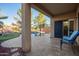 Covered patio overlooking the backyard pool area offers a relaxing outdoor retreat at 9009 S 57Th Dr, Laveen, AZ 85339