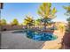 Sparkling backyard pool with patio area and lush landscaping at 9009 S 57Th Dr, Laveen, AZ 85339