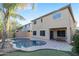 Backyard pool with palm trees, putting green and beautiful desert landscaping at 9009 S 57Th Dr, Laveen, AZ 85339