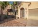 Inviting front entrance with stone pathway, desert landscaping and a security door at 9009 S 57Th Dr, Laveen, AZ 85339
