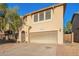 Charming two-story home with desert landscaping and an attached two car garage at 9009 S 57Th Dr, Laveen, AZ 85339