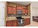 Well-equipped kitchen features stainless appliances, granite countertops, and sleek cabinetry for a modern touch at 9009 S 57Th Dr, Laveen, AZ 85339
