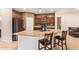 Kitchen with stainless steel appliances, granite countertops and bar stool seating for casual dining at 9009 S 57Th Dr, Laveen, AZ 85339
