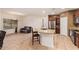 Modern kitchen with stainless steel appliances, granite counters, and an open floor plan to the living room at 9009 S 57Th Dr, Laveen, AZ 85339