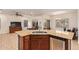 Stylish kitchen features granite countertops, stainless steel appliances, and an open layout to the living area at 9009 S 57Th Dr, Laveen, AZ 85339