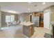Bright kitchen with granite counters, stainless appliances, and an adjacent dining area at 9009 S 57Th Dr, Laveen, AZ 85339