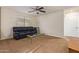 Upstairs living space features a couch, glass coffee table, and minibar for a cozy retreat at 9009 S 57Th Dr, Laveen, AZ 85339