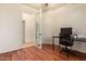 Office space includes a glass door with hardwood floors and offers great natural lighting at 9009 S 57Th Dr, Laveen, AZ 85339