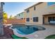Stunning backyard showcases a freeform pool, desert landscaping, and a private outdoor retreat at 9009 S 57Th Dr, Laveen, AZ 85339