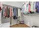 Walk-in closet featuring clothes, carpet flooring, and wire shelving at 9009 S 57Th Dr, Laveen, AZ 85339