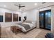 Stylish bedroom featuring hardwood floors, elegant decor, and a large window for ample natural light and comfort at 9735 E Kemper Way, Scottsdale, AZ 85255