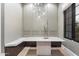 Elegant dining space featuring a built-in bench, marble table, and modern lighting fixture at 9735 E Kemper Way, Scottsdale, AZ 85255