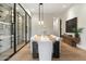 Spacious dining room boasting a wine display, modern table, and stylish decor at 9735 E Kemper Way, Scottsdale, AZ 85255