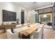 Modern dining room features a stylish table, chairs, and a seamless transition to the outdoor patio area at 9735 E Kemper Way, Scottsdale, AZ 85255