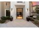 Inviting entryway with an open door, showcasing a glimpse of the interior living space and stylish decor at 9735 E Kemper Way, Scottsdale, AZ 85255