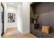 Modern entryway featuring wood accents, built-in storage, and stylish decor at 9735 E Kemper Way, Scottsdale, AZ 85255