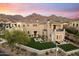 Stunning exterior of this two story home boasting a private yard, firepit and mountain views at 9735 E Kemper Way, Scottsdale, AZ 85255