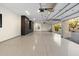 Spacious three-car garage with custom cabinets and epoxy floors at 9735 E Kemper Way, Scottsdale, AZ 85255