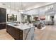 Open-concept kitchen with a marble island, flows into the living area, featuring contemporary design at 9735 E Kemper Way, Scottsdale, AZ 85255