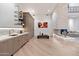 Contemporary living area featuring a bar, fireplace, and seamless design elements at 9735 E Kemper Way, Scottsdale, AZ 85255