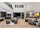 Spacious living room with modern furnishings and a view of the outdoor pool area at 9735 E Kemper Way, Scottsdale, AZ 85255