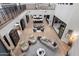 Open-concept living room with hardwood floors and views of the gourmet kitchen at 9735 E Kemper Way, Scottsdale, AZ 85255