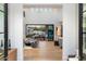 Bright living room with high ceilings, hardwood floors, and seamless indoor-outdoor flow to the patio at 9735 E Kemper Way, Scottsdale, AZ 85255