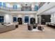 Grand living room featuring a soaring ceiling, light wood floors and a large seating area at 9735 E Kemper Way, Scottsdale, AZ 85255