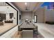 Covered patio features an outdoor kitchen, dining table, and easy access to indoors at 9735 E Kemper Way, Scottsdale, AZ 85255