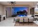 Covered outdoor dining area overlooks the pool and features a built-in kitchen at 9735 E Kemper Way, Scottsdale, AZ 85255