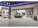 Expansive covered patio with multiple seating areas and an outdoor kitchen at 9735 E Kemper Way, Scottsdale, AZ 85255