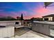 Beautiful outdoor patio with comfortable seating and a built-in kitchenette at 9735 E Kemper Way, Scottsdale, AZ 85255