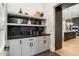 Pantry with open shelving and closed storage for kitchen appliances at 9735 E Kemper Way, Scottsdale, AZ 85255