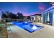 The home features a stunning pool with fountains, seating, and a patio at 9735 E Kemper Way, Scottsdale, AZ 85255