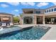 Beautiful backyard featuring a sparkling pool, lounge chairs, and outdoor living space at 9735 E Kemper Way, Scottsdale, AZ 85255