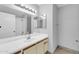 Bright bathroom with white vanity and mirrors at 101 N 7Th St # 210, Phoenix, AZ 85034