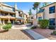 Inviting courtyard with multiple townhomes featuring a desert landscape and a central walkway at 101 N 7Th St # 210, Phoenix, AZ 85034