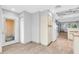 Hallway featuring white walls, tile floor and white appliances at 101 N 7Th St # 210, Phoenix, AZ 85034