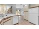 Kitchen area showcasing tiled countertops, wood trim and modern appliances at 101 N 7Th St # 210, Phoenix, AZ 85034