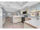 Bright kitchen with white tile counters and appliances, and wood-look flooring at 101 N 7Th St # 210, Phoenix, AZ 85034