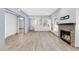 Bright living room featuring modern tile flooring, a stylish fireplace, and ample natural light at 101 N 7Th St # 210, Phoenix, AZ 85034