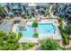 Stunning aerial view of a refreshing swimming pool surrounded by lush landscaping and lounge chairs at 101 N 7Th St # 210, Phoenix, AZ 85034