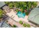 Aerial view of community pool with lounge chairs and garden at 101 N 7Th St # 210, Phoenix, AZ 85034