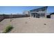Extensive backyard with gravel ground cover, providing a versatile outdoor space at 18207 W Daley Ln, Surprise, AZ 85387