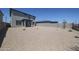 Spacious backyard featuring low-maintenance gravel landscaping and privacy wall at 18207 W Daley Ln, Surprise, AZ 85387