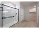 Bathroom includes modern shower, tile floor, and walk-in closet at 18207 W Daley Ln, Surprise, AZ 85387